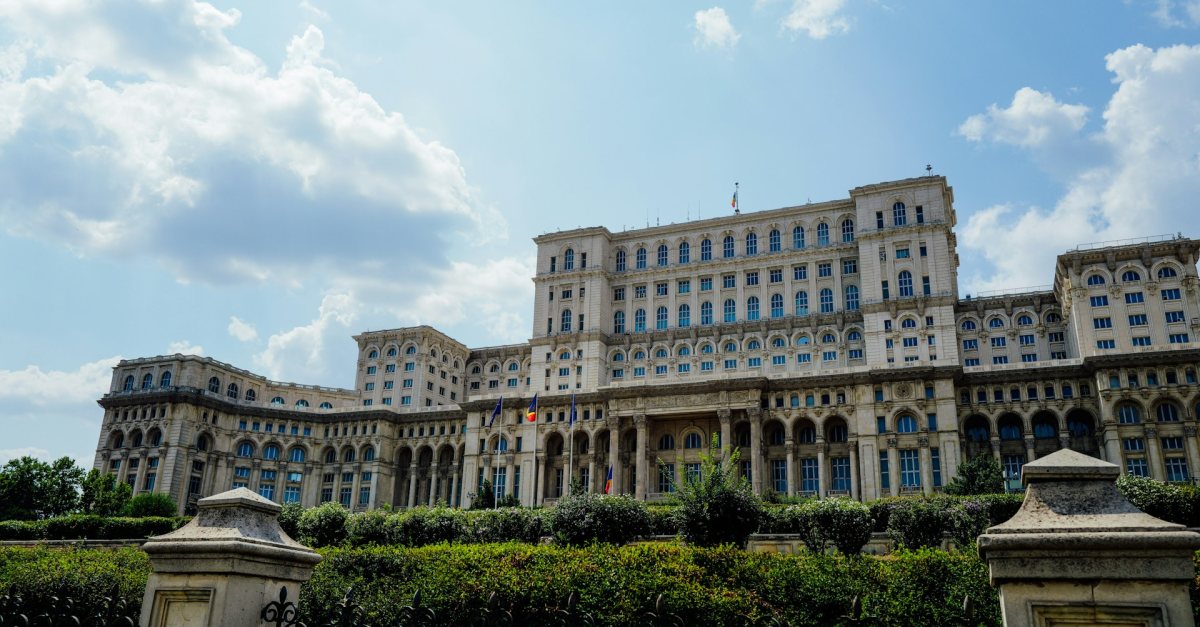 The Palace of the Parliament in Bucharest, seat of the Romanian Senate and Chamber of Deputies, under a blue sky